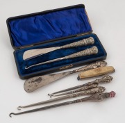 Assorted antique and vintage shoehorns, boot hooks and nail buff, early 20th century, (8 items), the largest 20cm long