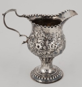 A Georgian sterling silver jug with floral decoration, made in London, circa 1770, 11cm high, 77 grams