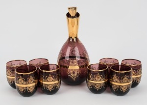 A Florentine amethyst glass decanter and eight matching glasses with gilt decorated highlights, mid 20th century, (9 items), the decanter 25cm high