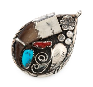 A Navajo silver pendant, set with eagle claw, turquoise and red stone, stamped "J. TOADLENA", 5.5cm high