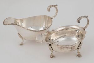 A Georgian sterling silver sauce boat, made in London, 18th century; together with an English sterling silver sauce boat by James Dixon & Sons of Sheffield, (2 items), 14cm and 14.5cm wide, 240 grams total
