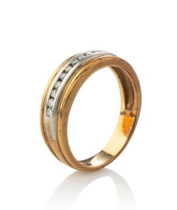 A 9ct yellow and white gold ring, set with a row of 11 diamonds, stamped "375", 4.1 grams