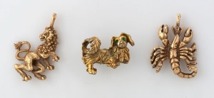 Two horoscope 9ct yellow gold pendants (Scorpio and Leo), together with a 9ct yellow gold Pekinese dog brooch, (3 items), ​​​​​​​23.9 grams total