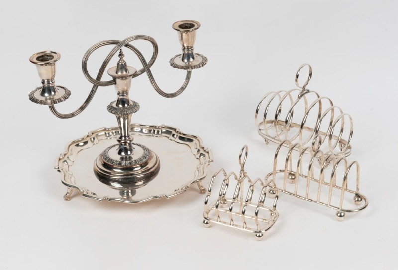 Three antique silver plated toast racks; together with a silver plated candelabra and salver, 19th and 20th century (5 items), ​​​​​​​the salver 24cm wide