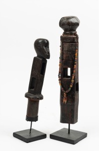 Tribal weaving stick tops, carved wood and trade bead, Congo origin,  both mounted on metal stands,  ​​​​​​​the larger 31cm high overall