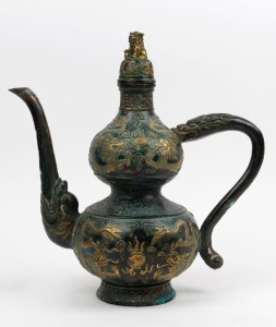 An antique Chinese bronze water pot with dragon decoration and gilded highlights, 19th/20th century, 34cm high