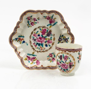 An antique teacup and saucer with hand-painted floral decoration, 18th century, the saucer 14cm wide