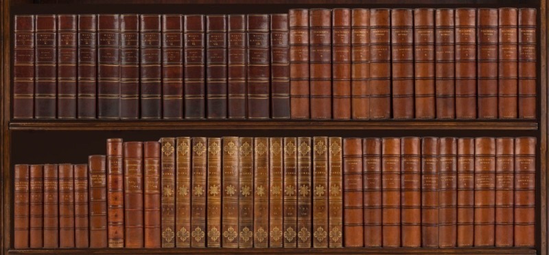 A shelf of superbly bound English literature, mainly 18th & 19th century editions, with works by Samuel Butler, William Makepeace Thackeray, Samuel Johnson, Edmund Spenser, Walter Scott and W.S. Gilbert. (56 volumes).