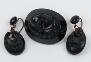 An antique jet mourning brooch and matching earrings, 19th century, ​​​​​​​the brooch 4.2cm wide