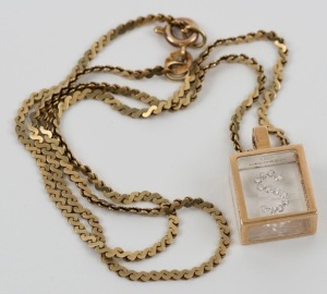 A 14ct yellow gold necklace with diamond set glass box pendant, 37cm long, 8 grams total