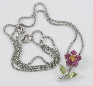 An Italian 18ct white gold floral pendant, set with citrine, pink sapphires and peridot, suspended on an 18ct Italian white gold chain, ​​​​​​​39cm long, 4.4 grams total