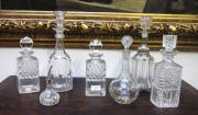 ANTIQUE DECANTERS: group of six 19th century crystal decanters and a bitters bottle with sterling silver top.&nbsp;