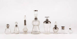 Group of eight vintage and antique vanity and perfume bottles with sterling silver mounts. 7 - 22cm