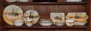 ROYAL DOULTON "Coaching Days" porcelain bowls, dishes, trivet, and plate; together with a series ware dish, 20th century, (33 items), the largest 28cm wide