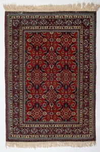 A Persian hand-woven rug with blue and red ground,  ​​​​​​​157 x 100cm 