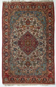 A Persian hand-knotted wool rug with ornate floral motif on cream, blue and red ground,  220 x 140cm
