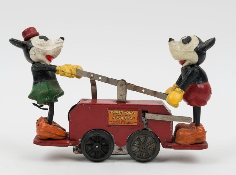 MICKEY & MINNIE MOUSE: wind-up Hand Car (Model No, 1100, with key), made by The Lionel Corp (New York); in good original condition (Mickey missing tail); length 26cm, height 15cm.