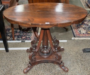 An antique rosewood oval centre table 19th century,  76cm high x 93cm wide x 67cm deep