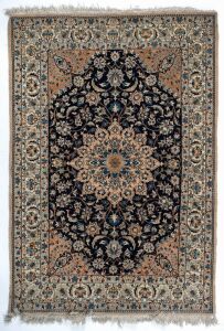 A Persian hand-knotted rug with blue and beige floral motif,  ​​​​​​​173 x 115 cm