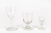 GEORGIAN WINE GLASSES: Group of 3 including a fine air twist stem wine glass with bell shaped bowl; faceted sherry glass c1830s & an early 19th century soda glass rummer.