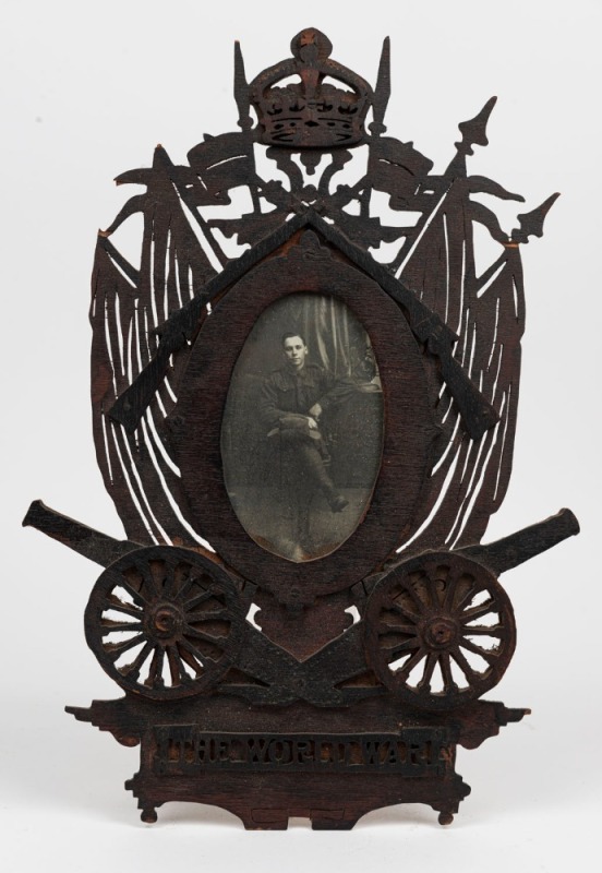 WW1 period military photograph in carved timber frame, titled "The Word War", ​​​​​​​36cm high