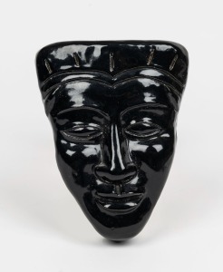 ARTIST UNKNOWN pottery face plaque with black glaze, incised signature (illegible), dated 1955, 14.5cm high