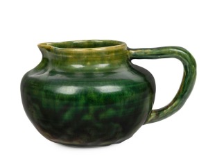CHARLES DREW green glazed pottery jug, incised "Charles Drew", 11cm high, 20cm wide