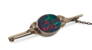 An antique 18ct white gold and platinum and opal bar brooch, early 20th century, stamped "18ct, PLAT.", ​​​​​​​4.5cm wide, 4.7 grams total