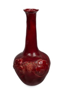 MABEL GIBSON Tasmanian hand-built pottery vase with applied grapes and leaves glazed in pigeon blood red, incised "Mabel B. Gibson", an impressive 32cm high