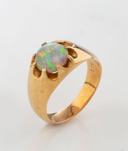 A gent's 9ct yellow gold signet ring, set with a fine solid polished opal, stamped "9ct", ​​​​​​​7.8 grams total