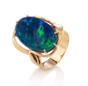 A yellow gold ring, set with a large black opal triplet stone, stamped "333", ​​​​​​​8.7 grams total