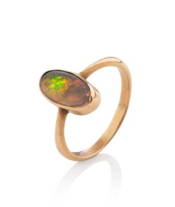 An antique gold ring, set with a solid jellybean opal, 2.1 grams total
