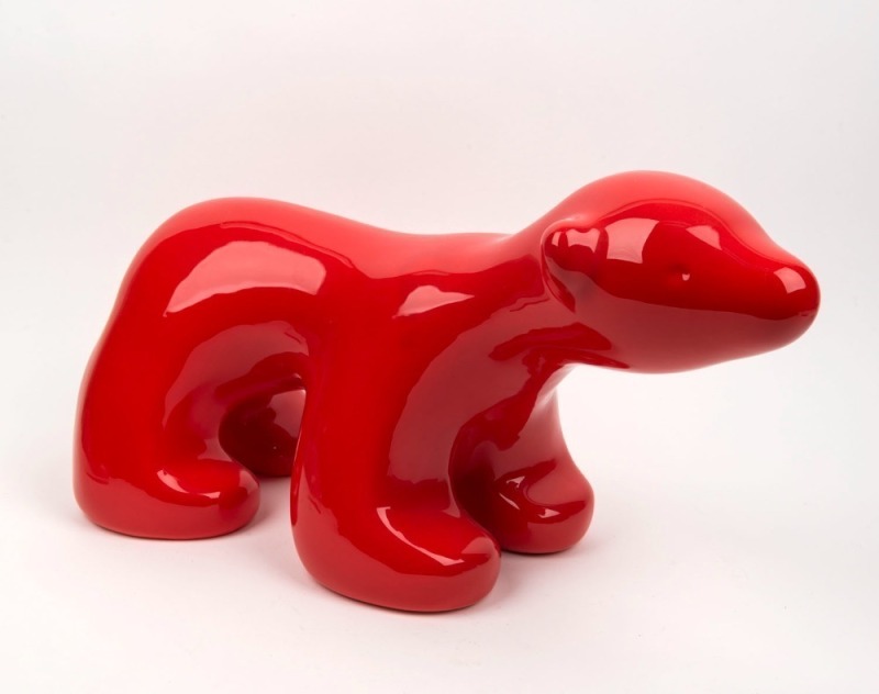 SCOTT REDFORD red glazed polar bear statue, ​​​​​​​26cm high, 54cm long