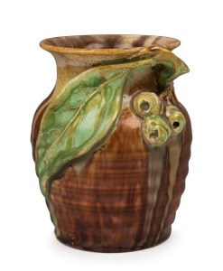 REMUED brown and green glazed pottery vase with applied gumnuts and leaf, incised "Remued", 10.5cm high