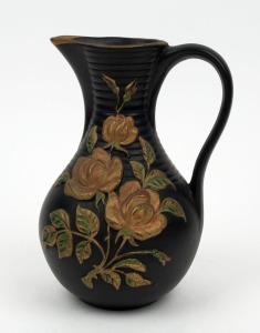 GOLD CROSS POTTERY black ceramic jug with rose motif, Western Australian origin, impressed cross mark "Gold Cross Pottery". ​​​​​​​19cm high