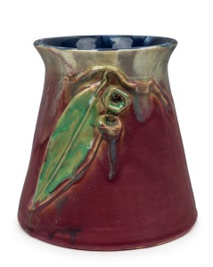 REMUED pottery vase beautifully glazed in pink and green with blue interior, adorned with applied gumnuts and leaf, rare shape, incised "Remued Hand Made 180/6M", 17cm high, 17cm wide