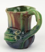 REMUED pottery jug with applied gumnuts, leaf and branch handle, glazed in early lime green, pink and blue, incised "Remued", 10.5cm high - 3