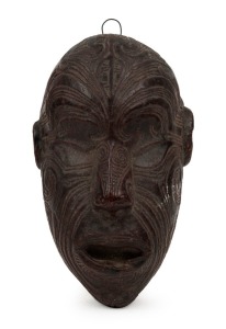 MAORI face plaque, hand-finished moulded composite, stamped "AUCKLAND MUSEUM", early to mid 20th century, 15.5cm high