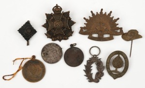 Small group of mainly WW1-era hat badges, fobs, etc. (9 items).