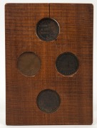 SHOP TOKENS. Group of four Australian examples mounted in fiddle back timber frame, 19th century,  17 x 12cm overall - 2