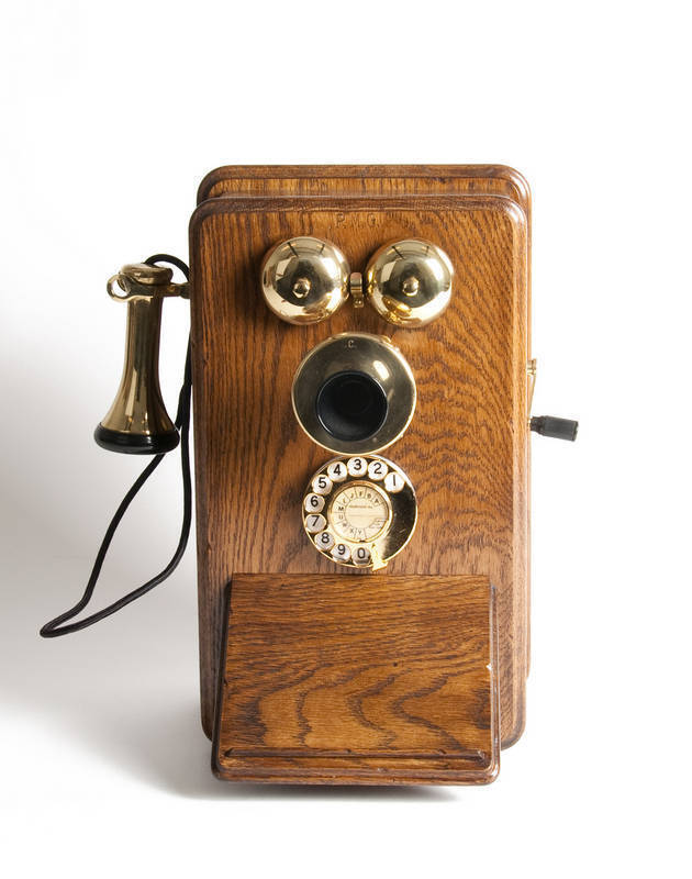 Antique oak cased rotary dial wall phone with brass fittings, c1900. Height 40cm, width 36cm, depth 24cm