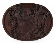 An Australian folk art oval panel with carved koalas in foliage, early to mid 20th century, ​​​​​​​34 x 46cm