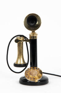 A black & brass rotary dial candlestick phone & receiver c1920 with cloth covered cord. 30cm