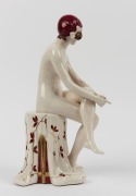 ROYAL DUX Czechoslovakian Art Deco porcelain statue of a seated nude in burgundy cap, pink triangle mark to base, 36cm high - 2