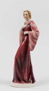GOLDSCHEIDER (attributed) Art Deco porcelain statue of a lady in a pink evening gown, 31cm high