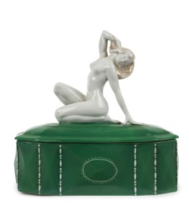 A Continental Art Deco green porcelain jewellery casket with nude figural top, circa 1930, 24cm high