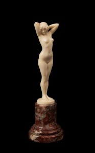JOSEPH DESCOMPS French Art Deco carved ivory statue of a standing female nude mounted of rouge marble base, circa 1930, signed "Joe Descomps", 16cm high overall