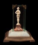 A Continental Art Deco carved ivory statue of a standing female nude mounted on rouge marble base and housed in a bespoke glass cabinet on marble and bronze base, circa 1930, the case 16cm high overall - 2