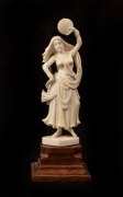 An Indian carved ivory&nbsp;statue of a dancing woman on timber plinth, early to mid 20th century, 18cm high