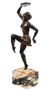 A Continental&nbsp;Art Deco statue of a dancing lady with a tambourine, bronze finish cast metal on a marble base, circa 1935, 47cm high overall